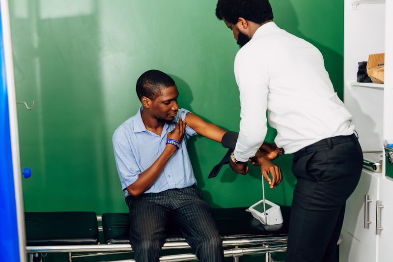 Healthcare worker attending to a patient
